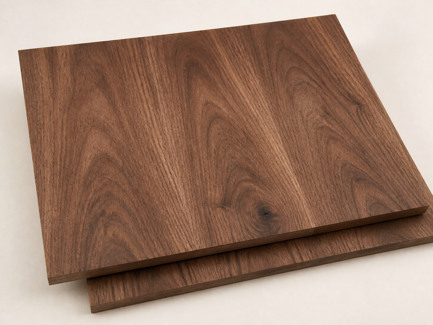 Warm crown-cut walnut veneer panels with broad expressive cathedral figure