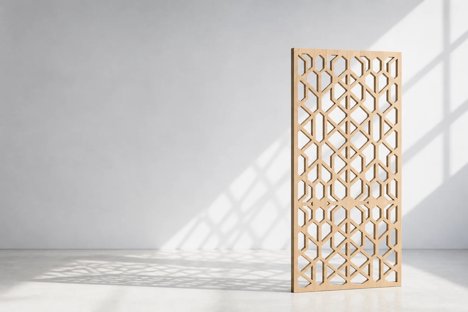 Geometric CNC-cut see-through decorative screen positioned in a bright studio
